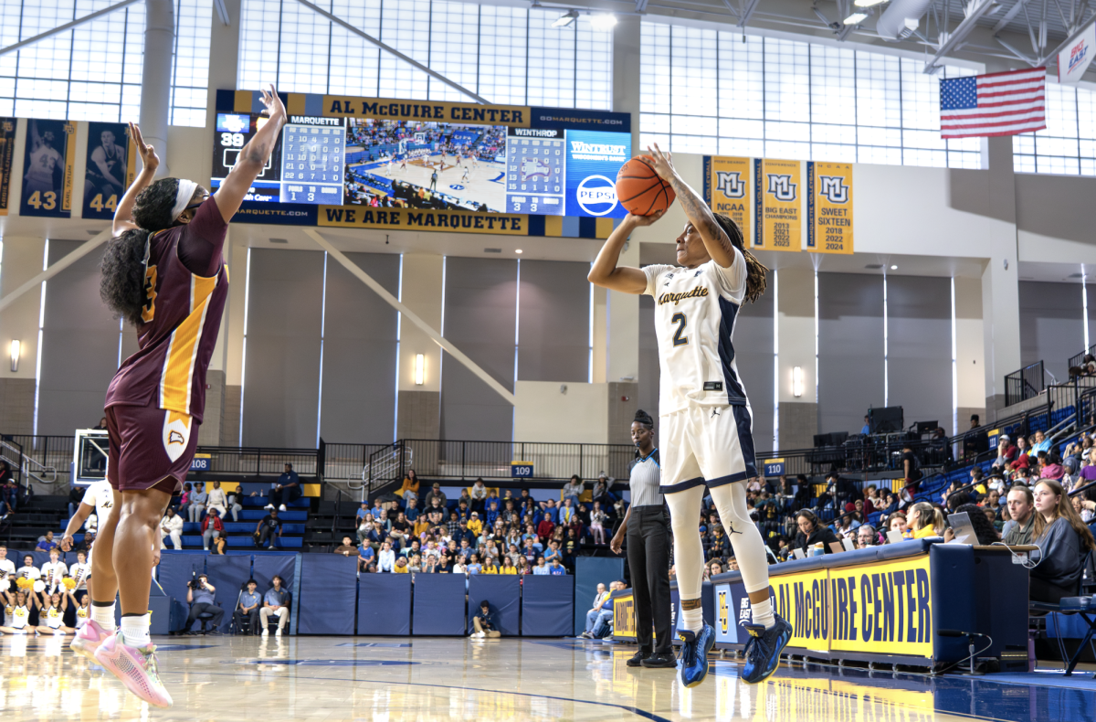 Jaidynn Mason attempts a 3-pointer in Marquette's season-opener.