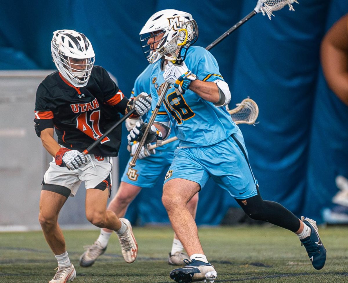Ethan Salvia (right) scored the game-winning goal for Marquette men's lacrosse in its 14-13 win over Providence on Saturday.