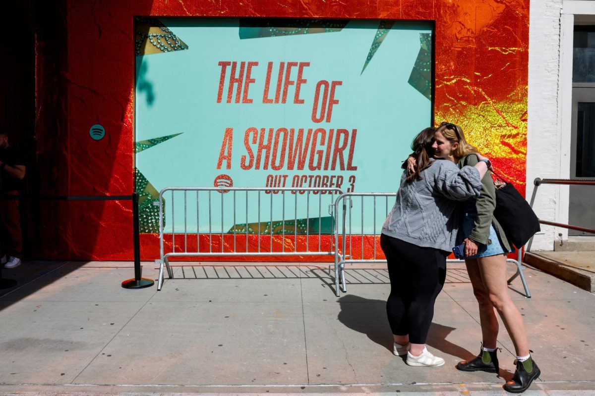 People hug outside a Spotify pop-up event for Taylor Swift's album "The Life of a Showgirl" in New York City, U.S., September 30, 2025. REUTERS/Kylie Cooper/ File Photo