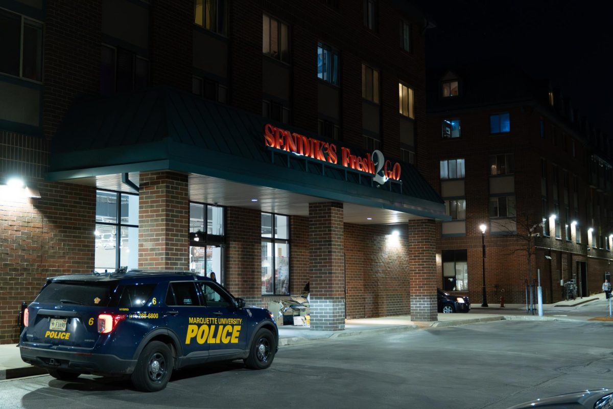 Security cameras caught a man attempting to stab a female student twice with a knife at the entrance of the on-campus grocery store.