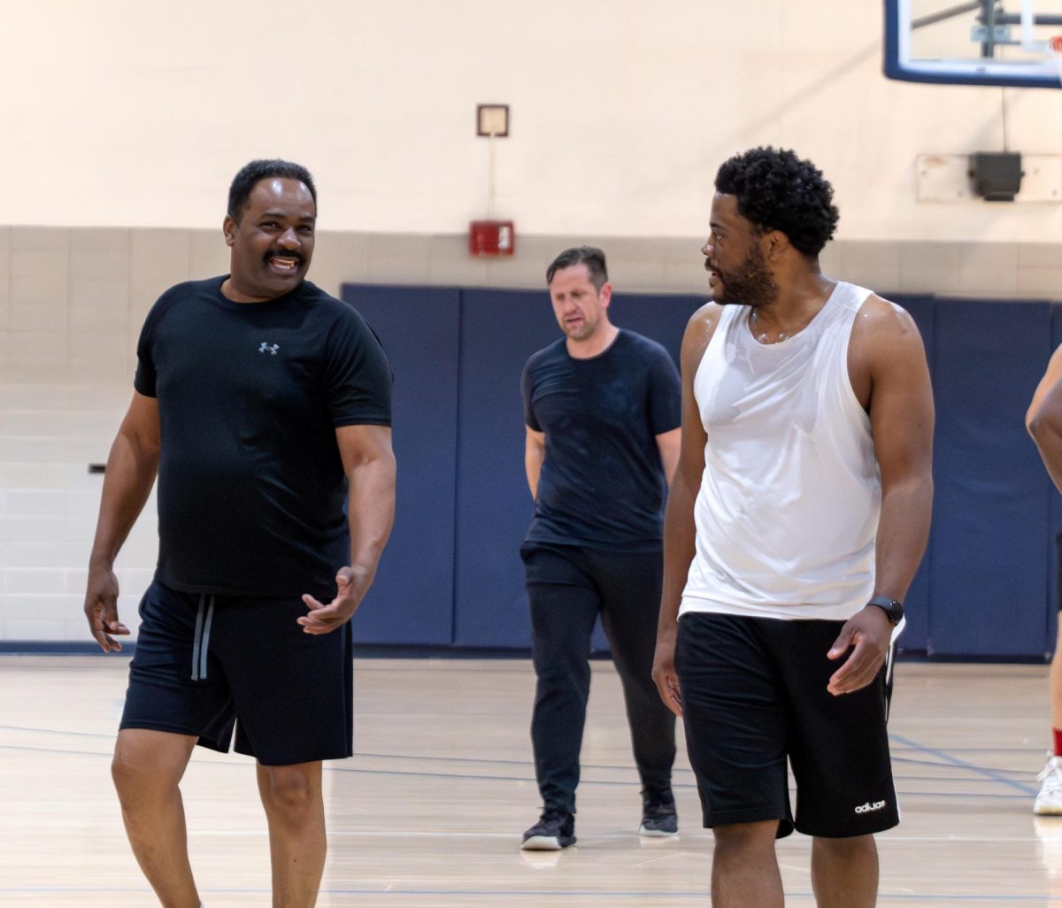 Cy Cullen (left) started playing basketball in his 30s and still participates in Noon Hoops at 67 years old.