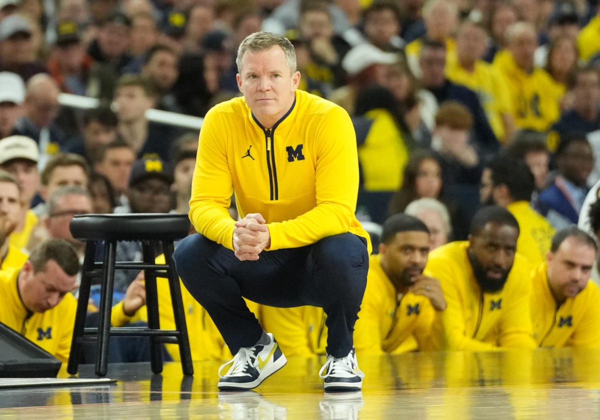 Apr 6, 2026; Indianapolis, IN, USA; Michigan Wolverines head coach Dusty May reacts against the Connecticut Huskies in the first half during the national championship of the Final Four of the men's 2026 NCAA Tournament at Lucas Oil Stadium. Mandatory Credit: Robert Deutsch-Imagn Images
