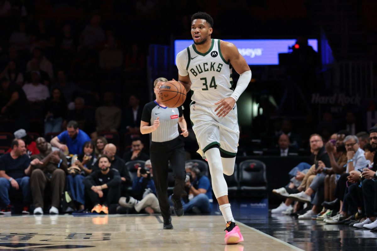 Mar 12, 2026; Miami, Florida, USA; Milwaukee Bucks forward Giannis Antetokounmpo (34) dribbles the basketball against the Miami Heat during the first quarter at Kaseya Center. Mandatory Credit: Sam Navarro-Imagn Images